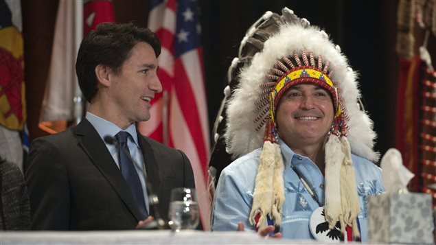  Prime Minister Justin Trudeau and AFN National Chief Perry Bellegarde laugh as they talk before the beginning of the Assembly of First Nations Special Chiefs Assembly in Gatineau, Tuesday December 8, 2015. 