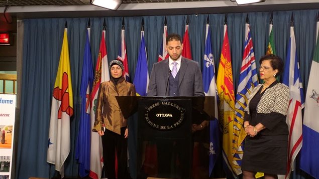  Ahmad Attia (C) speaking at a press conference in Ottawa on Dec. 10, 2015, with Senator Mobina Jaffer (R) and family friend Nadia Abu-Zahra (L).