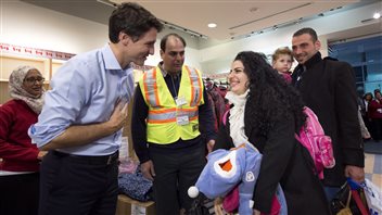 Prime Minister Justin Trudeau greeted Syrian refugees arriving at Toronto’s airport on Dec. 11, 2015.