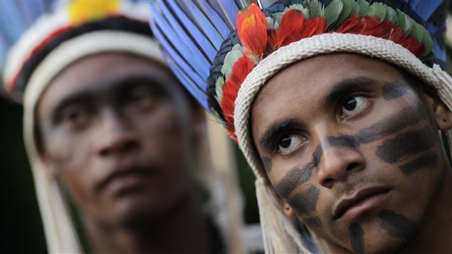  Indigenous Indians listen to a speech by an Indigenous Indian chief during their demonstration against proposed constitutional amendment PEC 215, which amends the rules for demarcation of indigenous lands, in Brasilia October 3, 2013. 