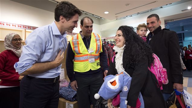 Canada’s Prime Minister Justin Trudeau went to the airport in Toronto in December 2015 to welcome Syrian refugees.