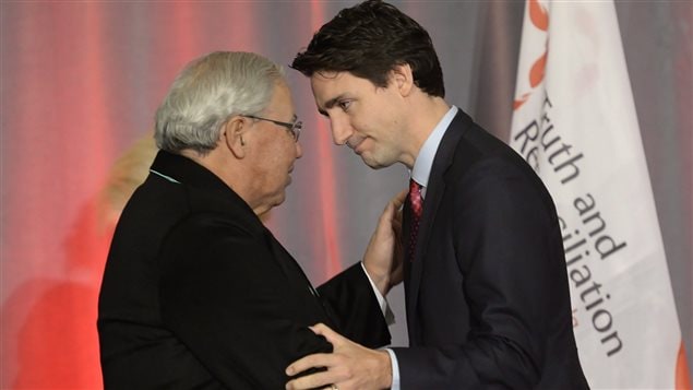  Prime Minister Justin Trudeau (right) greets Justice Murray Sinclair at the release of the Final Report of the Truth and Reconciliation Commission of Canada on the history of Canada’s residential school system, in Ottawa on Tuesday, Dec. 15, 2015. 