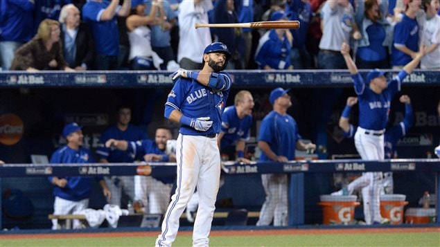 Toronto Blue Jays Jose Bautista flips his bat after hitting a three-run homer during baseball division finals on October 14, 2015. The flip went viral as did the story of the team’s brilliant season.