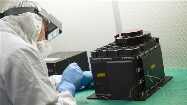  A technician prepares the OLA sensor head for testing at NASA’s Goddard Space Flight Center in Baltimore, Maryland. 