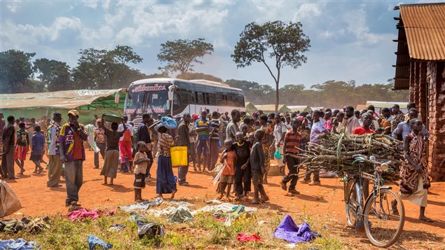 Refugees from Burundi who fled the ongoing violence and political tension arrive at the Nyarugusu refugee camp in western Tanzania in this May 28, 2015 handout photo by PLAN INTERNATIONAL.