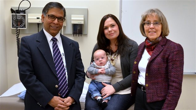 Dr. Abhay Lohda, mom Janine Charles and baby Deegan, and Prof. Karen Benzies celebrate the success of a first experience in a project to involve parents sooner in the care of their preterm babies.