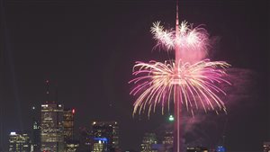 Fireworks are set off from the CN Tower at the conclusion of the opening ceremonies for the 2015 Pan Am Games in Toronto in July. We see lovely, high-flying fireworks surrounding the CN Tower with downtown Toronto in the near background.