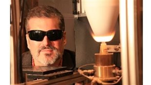 Professor J Bergthorson (PhD) with an aluminium flame. The dark glasses are for eye protection since the aluminum flame is so bright (because it burns at 3000 degrees C!