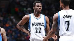 Andrew Wiggins appears to be a budding start in the National Basketball Association. We see Wiggins wearing a white uniform with blue trim with the