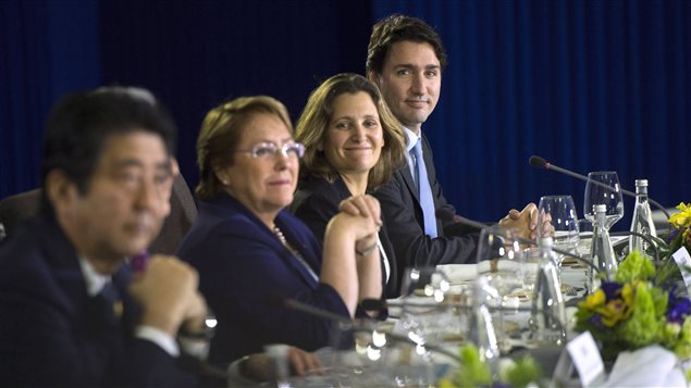  Prime Minister Justin Trudeau, right, sits beside Minister of International Trade Chrystia Freeland as they take part in a Trans-Pacific Partnership meeting on the side-lines of the APEC Summit in Manila, Philippines on Wednesday, November 18, 2015.