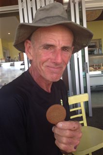 Canadian John Beeden enjoys a cookie after bacame the first man to row across the Pacific Ocean, a journey that took him 209 days to complete.