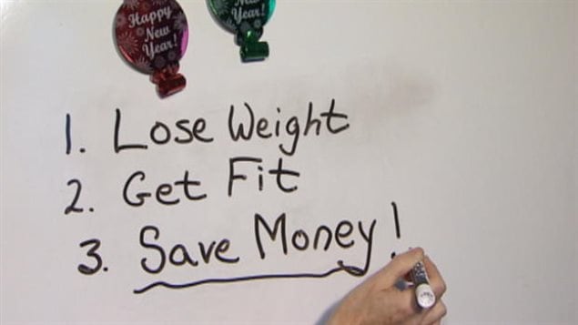Researchers say they've found something that might help with those resolutions. We see a piece of paper with a couple of prints of New Year's balloons at the top. Below the balloons is a list. Behind No. 1 is written "Lose Weight." Behind No. 2. is written "Get Fit." Behind No. 3. is written "Save Money!" Those words in No. 3 are underlined by a hand that appears at the bottom of the frame holding a pen.