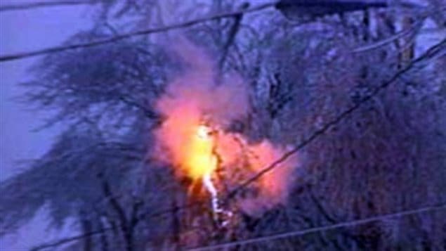 Branches weighed down by ice drop onto power lines causing firey connections. Overloaded and short circuited transformers also blew up causing still further blackouts.