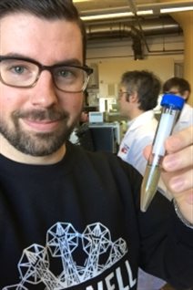 Halifax bar-owner Chris Reynolds in the Dalhousie University lab with a vial of Alexamder keith’s beer estimated to be about 125 years old