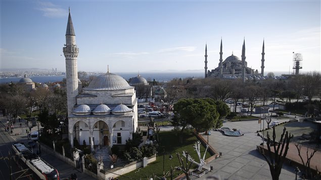  A view of the Sultan Ahmed Mosque, right, better known as the Blue Mosque in the historic Sultanahmet district of Istanbul, the area of an explosion, Tuesday, Jan. 12, 2016. 