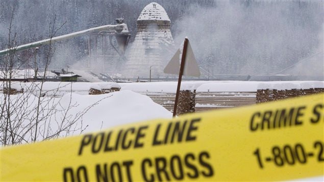 Smoke rises from the Babine Forest Products mill on January 12, 2012. This one of two explosions at British Columbia sawmills killed two workers and injured 20.
