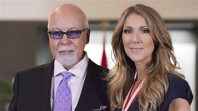  Celine Dion and husband Rene Angelil pose for photos after being decorated with the Order of Canada in Quebec City on Friday, July 26, 2013.
