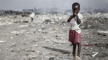 A child plays at a dump in Nairobi while his mother sorts through garbage. He says his family can’t afford to send him to school. Around 34 per cent of Kenya’s population lives in extreme poverty.