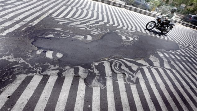 In India, roads began to melt and at least 2,000 people died as heat reached 50 degrees in some areas