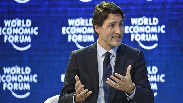  Canada’s Prime Minister Justin Trudeau gestures as he speaks during a panel *The Canadian Opportunity*at the World Economic Forum in Davos, Switzerland, Wednesday, Jan. 20, 2016.