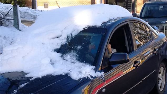 This is not how to clear snow off your car. In fact, driving this way is illegal in most of Canada.