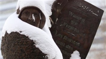 Statue shows activist Nellie McClung holding a 1929 announcement instrumental in the campaign to win the right to vote for women.