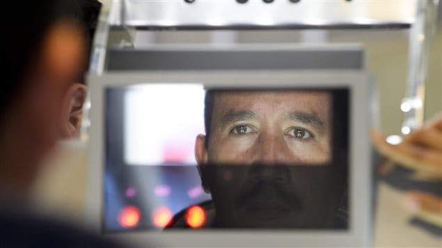 Facial features and eyes are scanned at a biometric kiosk in San Diego, California. Biometrics are also used by customs agents in Canada.