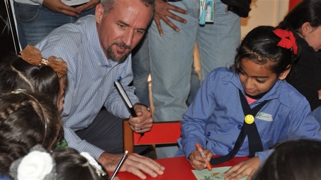  Robert Jenkins With Jordanian and Syrian girls at a Makani centre in a host community in Jordan. UNICEF initiated ‘Makani’ (means my space in Arabic) centres in 2015 to provide children and youth with all three services (psychosocial support, informal learning, life skills training) under one roof. - 2015