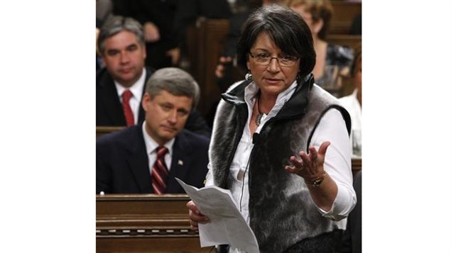 June 11-2008 National Inuit leader Mary Simon wears a sealskin vest while speaking as Canada’s (then) Prime Minister Stephen Harper (bottom L) listens in the House of Commons on Parliament Hill in Ottawa 