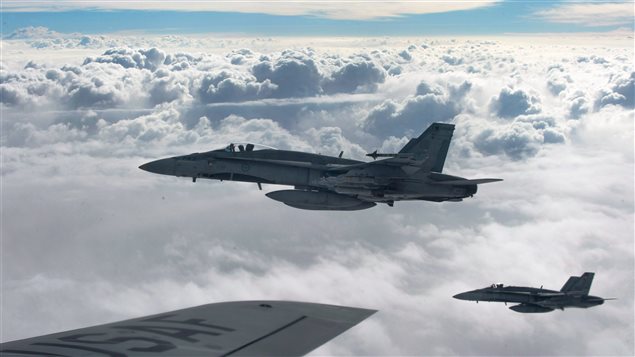  Royal Canadian Air Force CF-18 Hornets depart after refueling with a KC-135 Stratotanker assigned to the 340th Expeditionary Air Refueling Squadron, October 30, 2014, over Iraq.Canadian fighter jets taking part in the air campaign against the Islamic State of Iraq and the Levant have had a busy start to 2016.