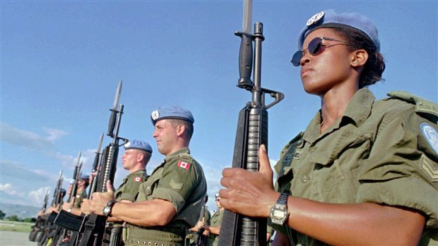 Canadian peacekeepers prepare for a parade in Port-au-Prince, Haiti on Nov. 28, 1997.