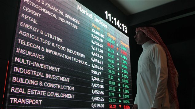  An investor monitors a screen displaying stock information at the Saudi Stock Exchange (Tadawul) in Riyadh, Saudi Arabia January 18, 2016. 
