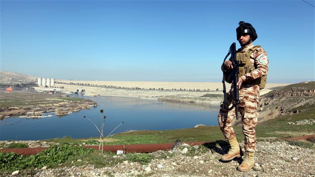  An Iraqi Kurdish Peshmerga stands guard near the Mosul Dam in northern Iraq, February 3, 2016. 