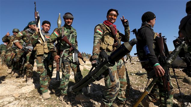  Members of the Kurdish peshmerga forces gather in the town of Sinjar, Iraq November 13, 2015.