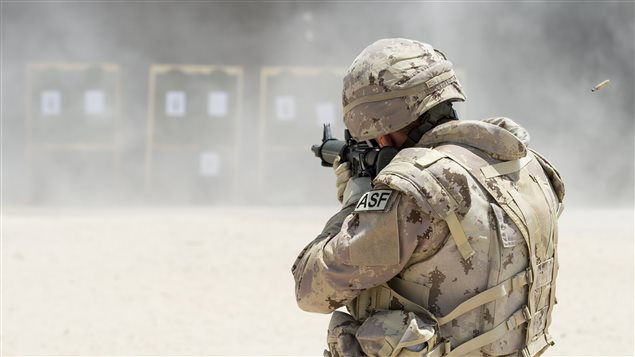  A member of Air Task Force - Iraq Auxiliary Security Force (ASF) takes aim at a shooting range in Camp Patrice Vincent, Kuwait, during Operation IMPACT. (Photo: OP IMPACT, DND)