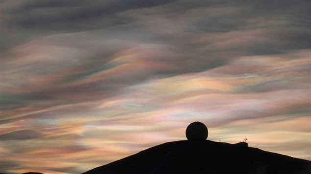 23 Aug 2009: irridescent clouds over the NASA Radome, McMurdo Station, Antarctica. While they can be beautiful, they also indicate the presence of compounts which destoruy the protective ozone layer 