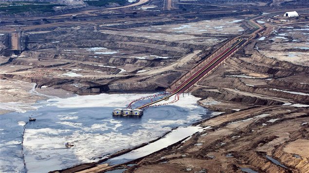 More than half of Canada’s oil is extracted from oil sands facilities like this one near Fort McMurray, Alberta viewed on July 10, 2012.