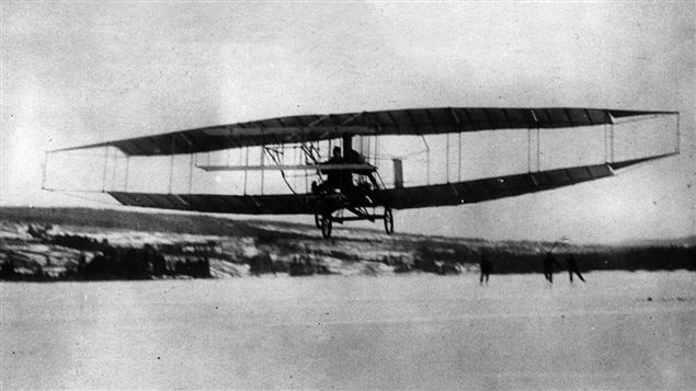 The Silver Dart with Douglas McCurdy at the controls lifts off from the frozen lake at Cape Breton, becoming the first powered flight in the British Empire.