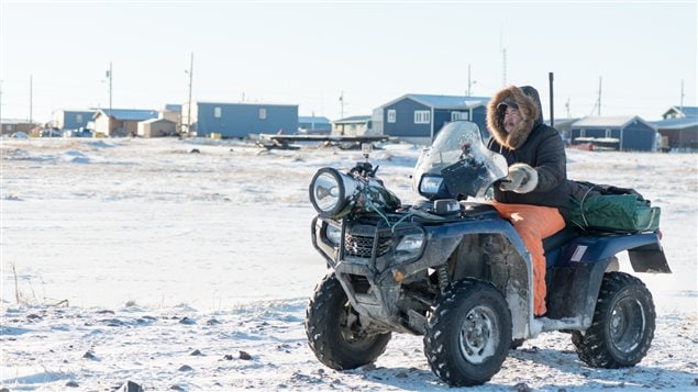 Polar bear patrol guard Leo Ikakhik in Arviat, Nunavut. The ATV along with noisebakers, bean bag guns, and other devices are used to scare the bears away from town. Firearms are now a last resort.