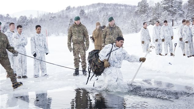  The US Marines get to go through the ice breaking drill instructed by the mountain leaders from the UK Royal Commando in Norway.