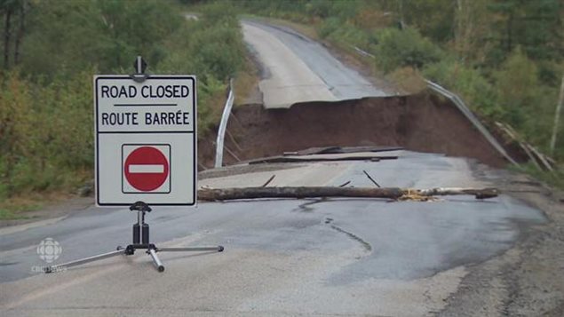 Unexpected heavy rains in late September 2015 in eastern Canada caused extensive damage to roads and bridges such as this road in New Brunswick where up to 160 mm of rain fell over a short period