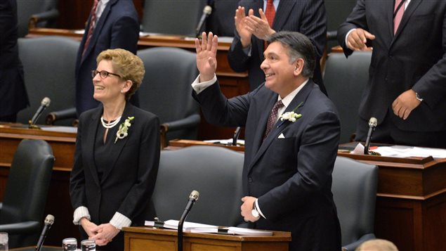 Ontario Premier Kathleen Wynne and Finance Minister Charles Sousa ahead of the tabling of Ontario’s 2016 budget, Queen’s Park, Toronto, Feb. 25, 2016. Canada’s most populous province says it will proceed with a trial of a guaranteed income plan