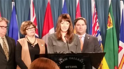 Activists and opposition members of Parliament held a news conference in Ottawa on March 7, 2016 to demand the closure of private blood clinics in Canada.