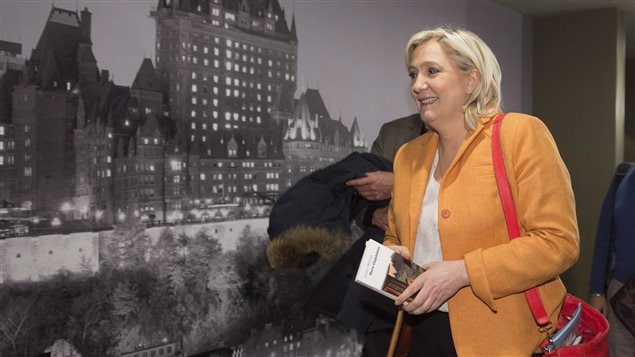  France Front National Leader Marine Le Pen leaves a news conference, Sunday, March 20, 2016 in Quebec City. THE CANADIAN PRESS/Jacques Boissinot