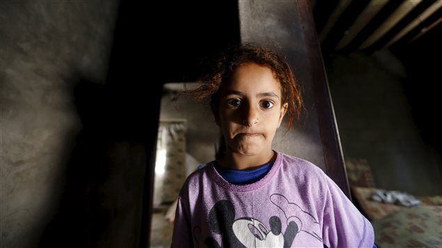  A girl looks as she stands in a house damaged by a Saudi-led air strike in Yemen’s capital Sanaa, September 11, 2015. 