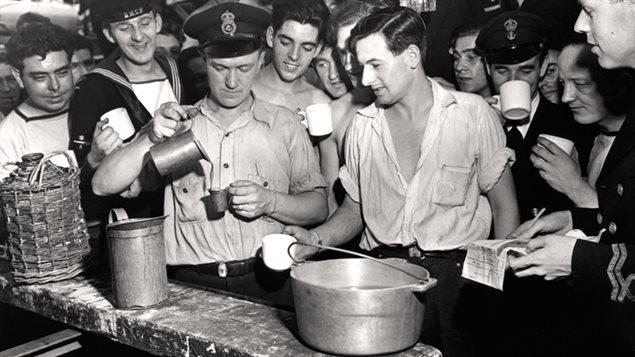Rum is distributed on board the corvette HMCS Arvida, September 1943. ARvida served as an Atlantic convoy escort and sruvived the war to be paid off in June 1945.