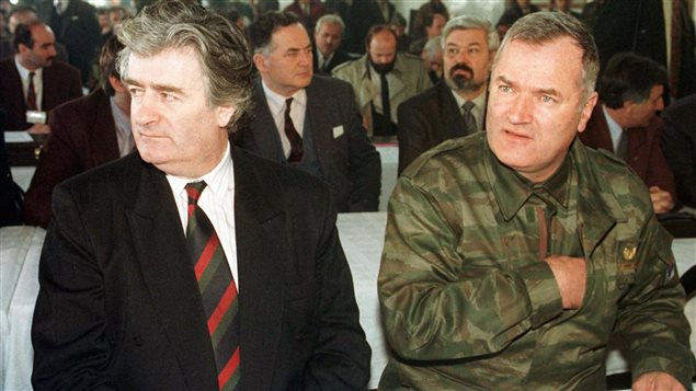  Bosnian Serb leader Radovan Karadzic, left, and Gen. Ratko Mladic attend an assembly session in Pale, near Sarajevo, Bosnia, in this undated file photo.