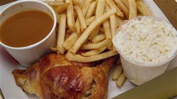  A quarter chicken leg in a take out box from St-Hubert in Montreal on Thursday, March 31, 2016. 