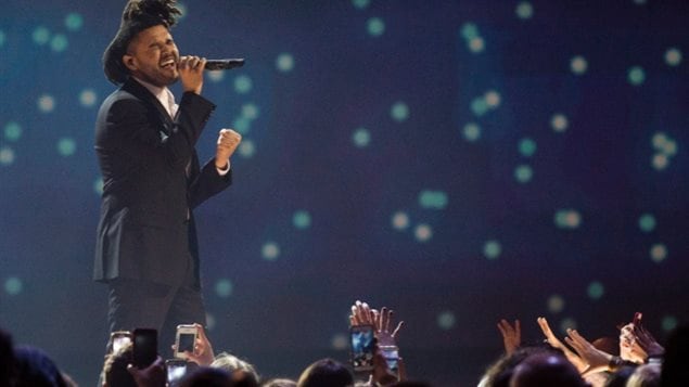 The Weeknd performs during the 2015 Juno Awards in Hamilton, Ontario. 