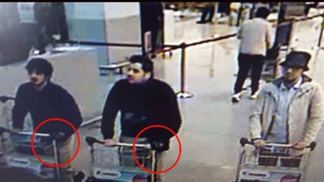 This image, released by the French-language daily newspaper La Dernière Heure, shows the three men who are suspected of participating in the attack on the Brussels airport in March